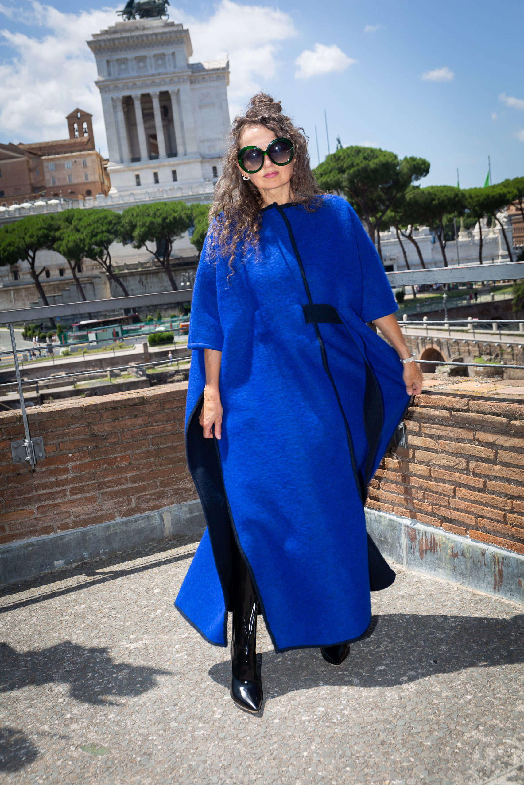 Ewa Zbaraszewska wearing her own blue coat design in Rome