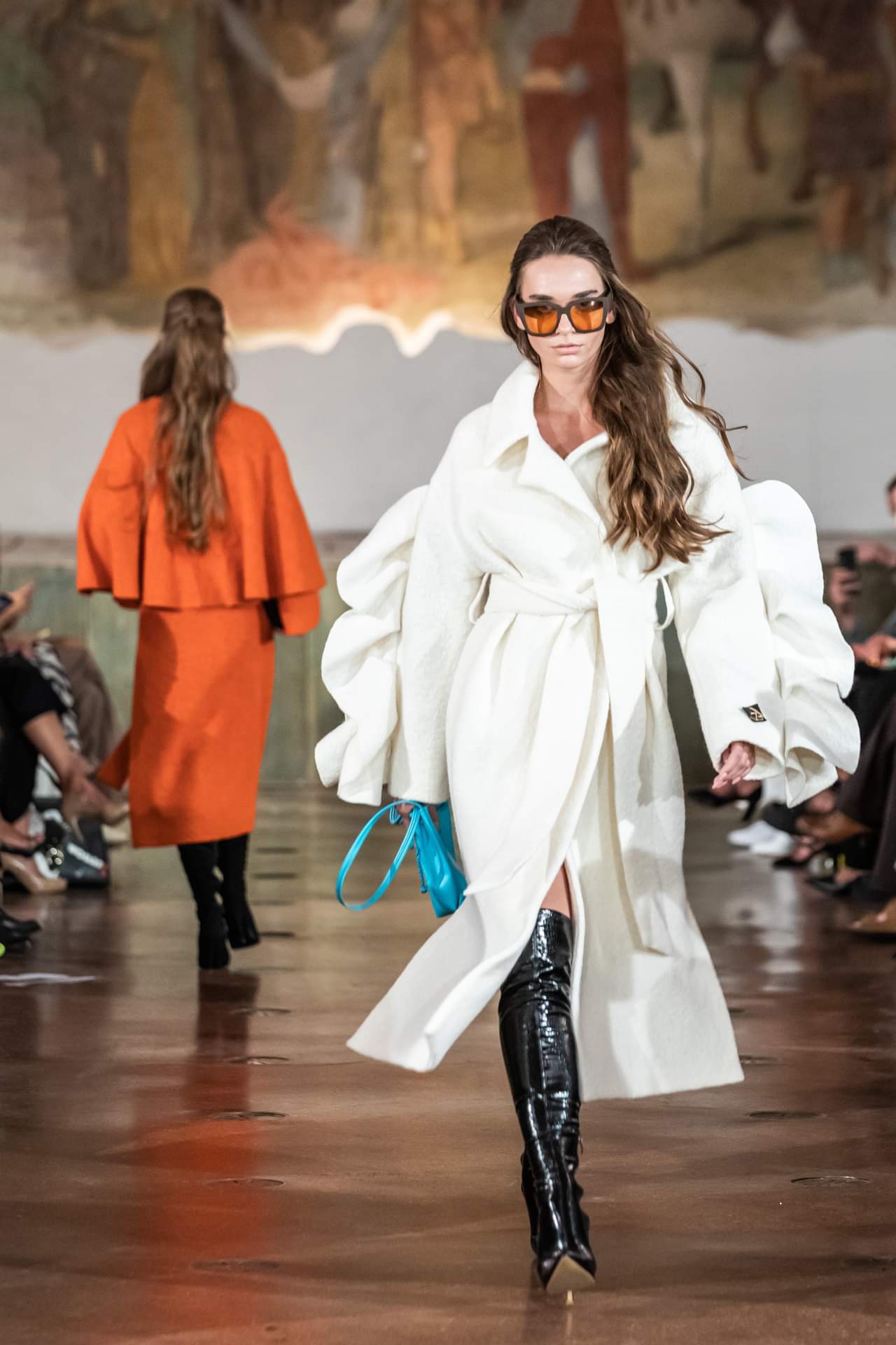Runway look: long white belted coat with statement sunglasses